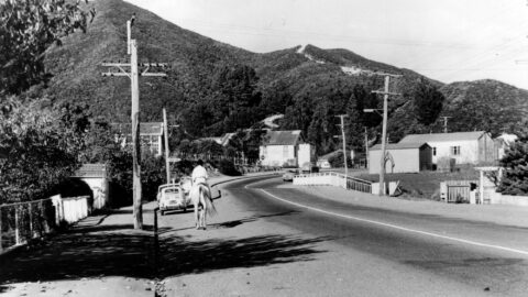 Main Road in 1970 with old school building (left), old Public Hall (centre), fire engine garage & Riverside Hall (right) - WHMS: L3034