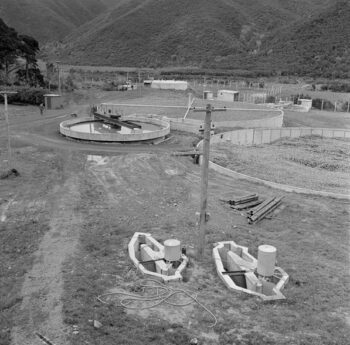 Wainuiomata Sewerage Plant with filtration tanks, Lower Hutt District, Wellington Region. Evening post (Newspaper. 1865-2002) :Photographic negatives and prints of the Evening Post newspaper. Ref: EP/1959/4203-F. Alexander Turnbull Library, Wellington, New Zealand. https://natlib.govt.nz/records/30654254