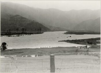 Photograph showing flooded farmland and possibly the Wainuiomata River near Jones' farm - 1985 - CC BY-NC-ND 3.0