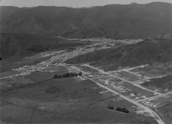 Aerial view of Wainuiomata, Wellington Region. Evening post (Newspaper. 1865-2002) :Photographic negatives and prints of the Evening Post newspaper. Ref: EP/1956/2604-F. Alexander Turnbull Library, Wellington, New Zealand. /records/23195998 Date: 25 Oct 1956